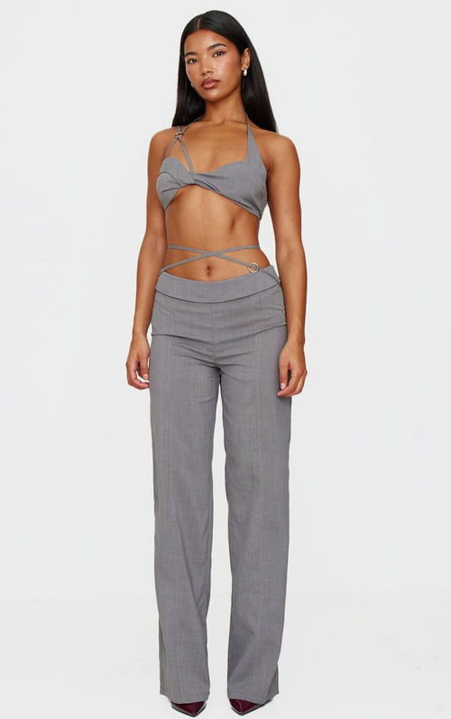 Chic women's two-piece pant set featuring a stylish halter top and tailored trousers