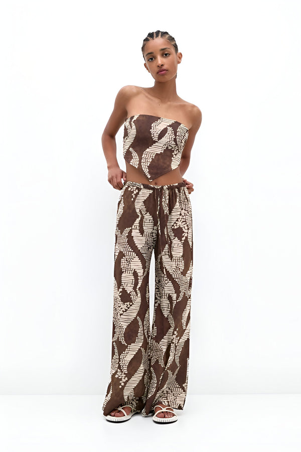 Trendy women's fashion sets featuring a stylish strapless top and wide-leg pants in a unique pattern