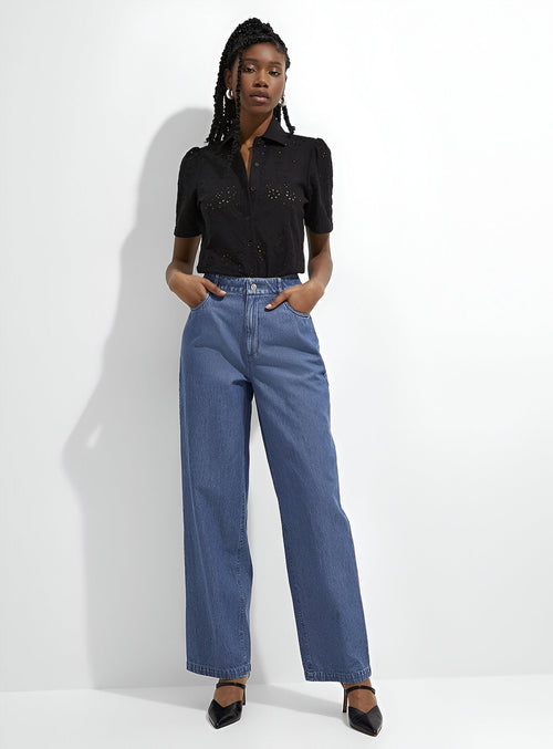Trendy stylish jeans for women in a wide-leg cut, paired with a black top for a chic look