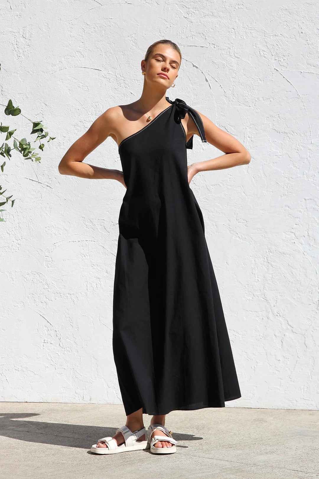 Zemy lace up sloping shoulder dress in black featuring a stylish one-shoulder design and a flowing silhouette